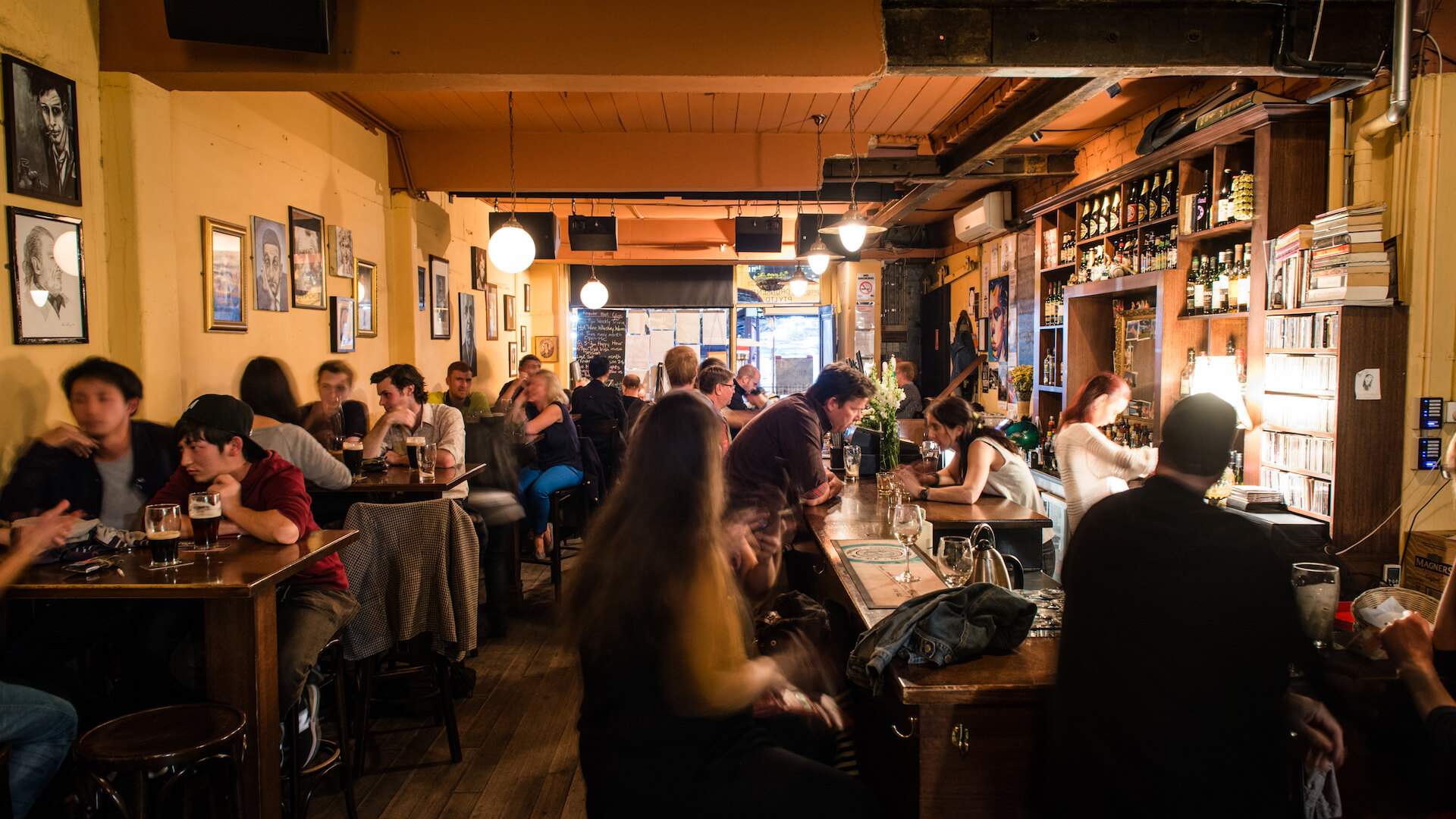 People drinking at the Drunken Poet in West melbourne - one of the best pubs in Melbourne
